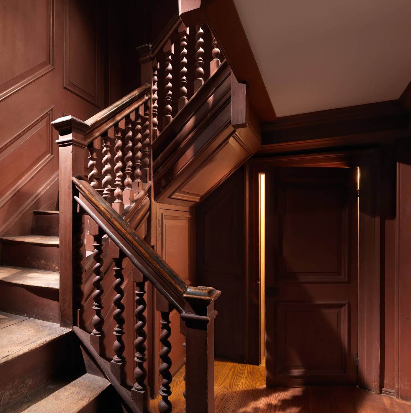 An early paneled staircase with turned barley-twist balusters